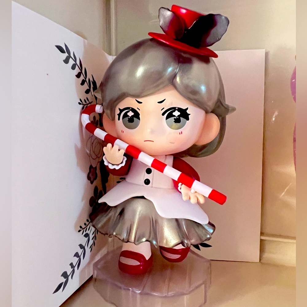 🎁Cute Figurine with Red and Silver Accents